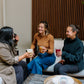 Friends gathered on patio at golden hour